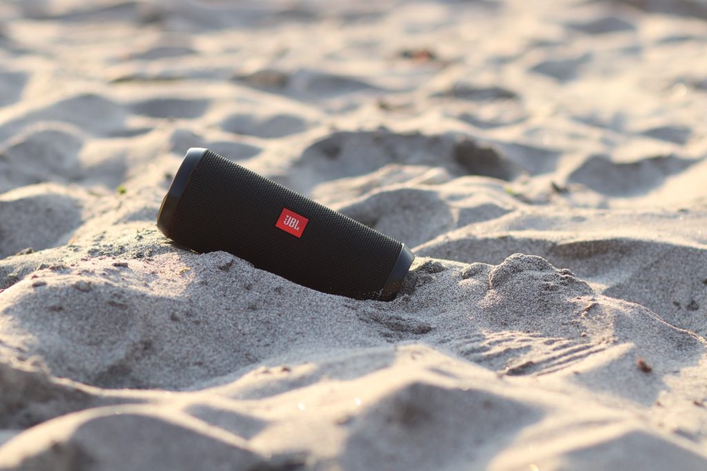 black and white plastic tube on sand